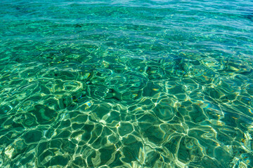 View of the turquoise see through waters of the Agia Theodoti beach in Ios Greece