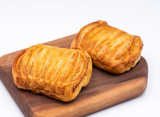Baked Ham and Cheese Danishes on Wooden Board side view of Savory Pastries