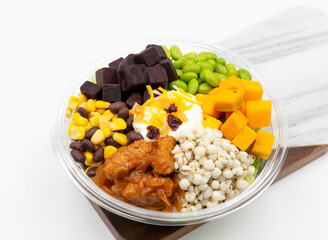 Colorful Plant-Based Chicken Strips Kimchi Bowl with edamame, corn, black beans, butternut squash, pearl barley, and creamy sauce top view of Nutritious Meal