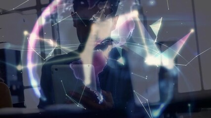 Tech pro holding tablet starting digital mesh forming rotating globe visualizing connections - Powered by Adobe