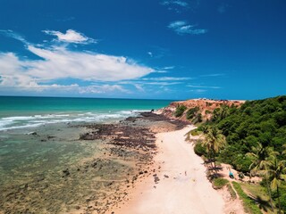 Aerial view of Praia da Pipa and Chapad&atilde;o cliffs in Pipa, Rio Grande do Norte, Brazil, showing paradise beaches, blue sea, and dramatic coastline &ndash; perfect summer destination