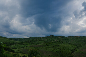 Sky with dark clouds and sun rays