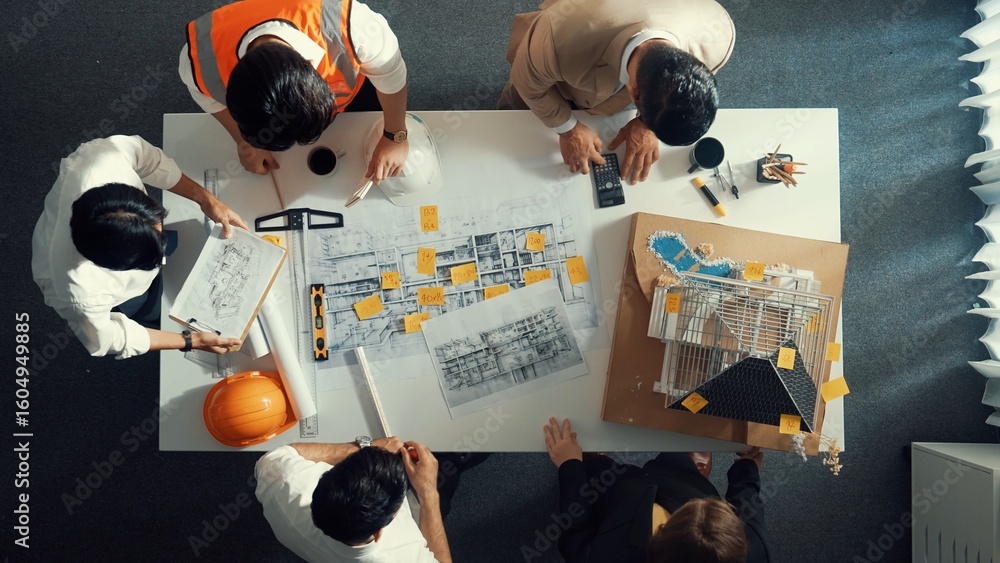 Poster top down view of skilled engineer team compare between blueprint and house plan. aerial view of grou