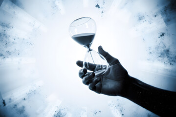 Holding Time: A hand cradles an hourglass, the fine grains of sand flowing downward. It's a symbolic depiction of the fleeting nature of time.