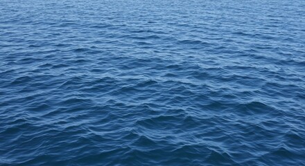 Obraz premium Ocean Water Texture Background - A tranquil of blue ocean water with gentle waves, ideal for backgrounds or textures