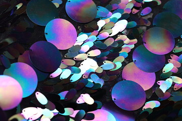 Black sequin fabric with large holographic paillettes—rainbow oil-slick shine ideal for fashion,...