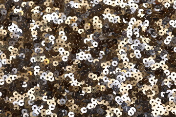 Gold and silver sequin fabric with large paillettes. Slick shine ideal for fashion, party styling, textiles, sparkle couture, dancewear, fashion, sewing, fashion design and festive glam backgrounds.