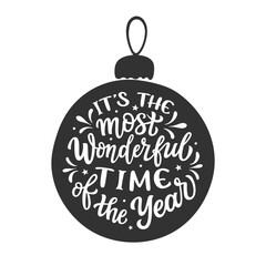 It's the most wonderful time of the year. Hand lettering Christmas quote in a Christmas ball isolated on white background. Vector typography for winter holidays posters, banners, cards, home decor