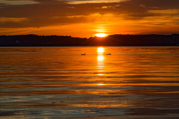 On the promenade and on Gluecksburg beach, the sunset at July 23rd is particularly colorful