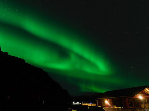 Green Aurora Borealis Dancing Across Dark Night Sky Iceland