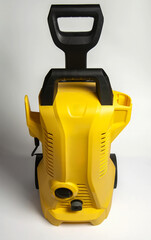 A vibrant yellow pressure washer, perfect for tackling outdoor cleaning tasks.