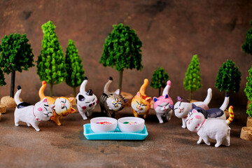 Celebrating International Cat Day with cute funny friends who are coming to eat a treat.