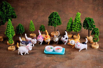 Cats of different colors gathered to taste the treats in honor of the holiday - International Cat Day.