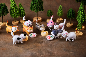 Cute kittens try a treat in honor of the holiday - International Cat Day.