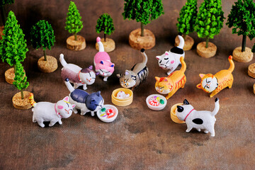 Charming cats run to try a treat in honor of the holiday - International Cat Day.