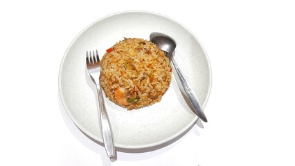 Seafood fried rice served on white plate isolated on white background. Food presentation business