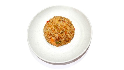 Seafood fried rice served on white plate isolated on white background. Food presentation business