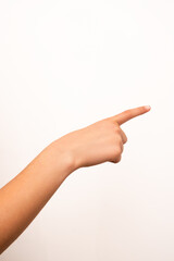 Human hand with extended index finger pointing right, isolated on a plain white background....
