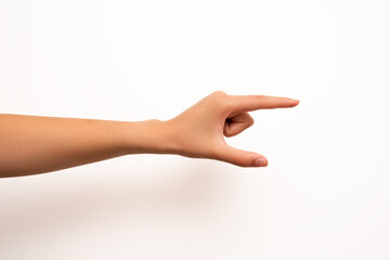 A human hand is isolated against a white background, making a pinching gesture with the thumb and...