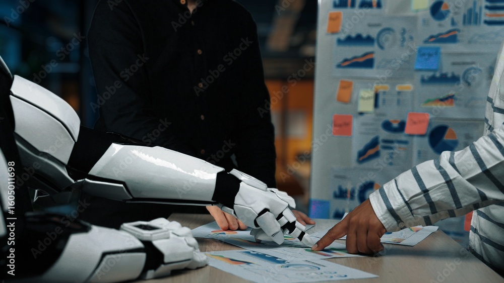 Poster a collaborative scene showcasing a humanoid robot and a human examining business charts and data. th