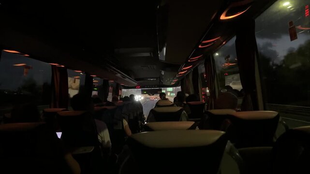 Large regular intercity bus with tourists. Tourist international transport. The interior of the bus, people passengers on a city tour. Transportation of employees to work.