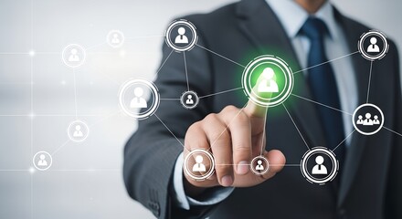 Businessman s hand touching a digital network of people icons representing connection and teamwork