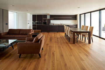 Fototapeta premium Contemporary Open Plan Living Space Featuring a Modern Kitchen and Comfortable Brown Leather Sofa Furniture Arrangement