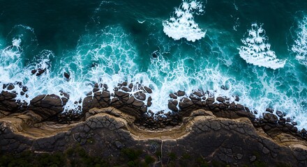Coastal Majesty: Aerial View of Waves Crashing on Rocky Shores, Turquoise Waters Meet Ancient Rocks: A Coastal Landscape from Above
