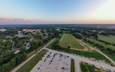 Various Sunset Drone Images of Downtown Raleigh NC Featuring the Skyline, Dix Park, and Central Prison.