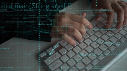 Close-up of hands typing on a keyboard with programming code overlay, illustrating the process of software development in a modern digital workspace. Xenic