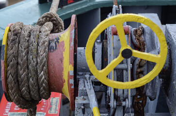 The offshore support vessel windlass with the warping head. The mooring rope is secures at the...
