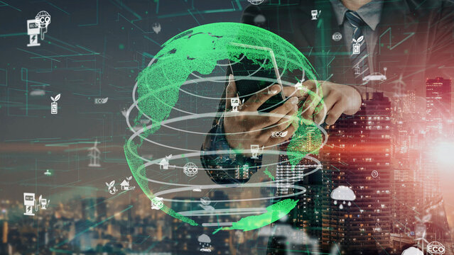 A professional businessman engages with a smartphone amidst a digital green globe. Eco-friendly icons highlight the merging of technology with sustainability in urban spaces. Xenic - Powered by Adobe