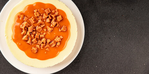 Cheesecake salted caramel sweet dessert fresh delicious gourmet food background on the table rustic food top view copy space