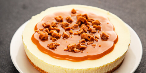 Cheesecake salted caramel sweet dessert fresh delicious gourmet food background on the table rustic food top view copy space