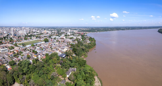 Beautiful aerial drone view of Porto Velho city center streets, buildings and Madeira river in the Amazon rainforest on sunny summer day. Rondonia state, Brazil.