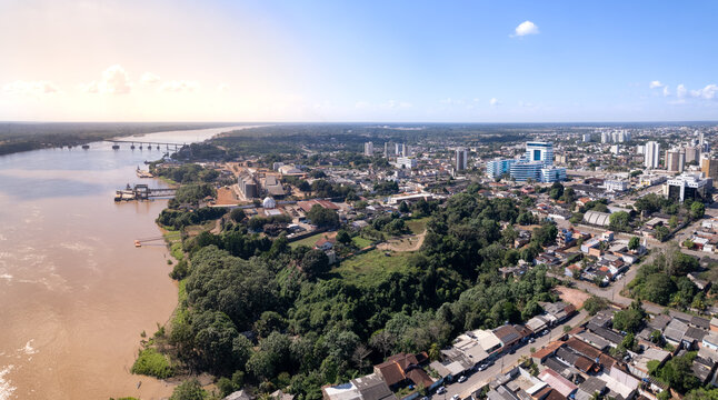 Beautiful aerial drone view of Porto Velho city center streets, buildings and Madeira river in the Amazon rainforest on sunny summer day. Rondonia state, Brazil.