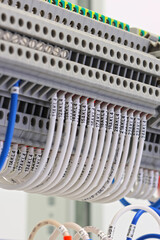 Electrical terminals with connected insulated copper wires with metal lugs. Marking with a thermal...