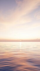 Obraz premium Gentle pink and lavender sky blankets a peaceful expanse of water as the sun begins its descent creating a tranquil view