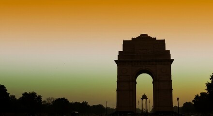 Fototapeta premium India Gate Silhouette Against Sunset Sky in Delhi, India, Monument Architecture and Landmark