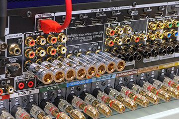Rear panel of a high-quality AV receiver with multimedia connections for connecting speakers,...