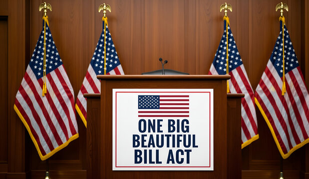 A formal wooden podium displaying the "One Big Beautiful Bill Act" sign flanked by four American flags inside a chamber.