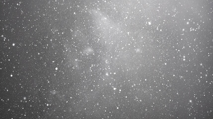 Celestial Dance of Dust and Light: A mesmerizing grayscale photograph captures the enchanting spectacle of airborne particles gracefully illuminated, with the soft diffusion of light.