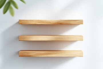 rows of empty wooden shelves casting soft shadows on white wall