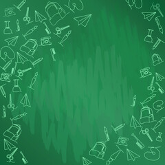 School supplies and educational tools laid out on a green chalkboard background