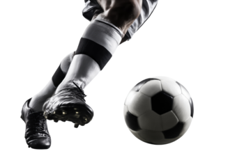Soccer player kicking a black and white ball with striped socks isolated on a transparent background