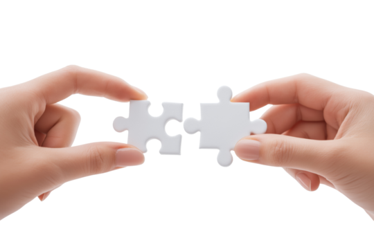 Two hands holding white puzzle pieces about to connect isolated on a transparent background jigsaw