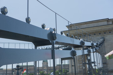 Close up of the robust steel structure of budapests szechenyi chain bridge, highlighting its engineering and architectural details against a clear sky, concept of bridge construction