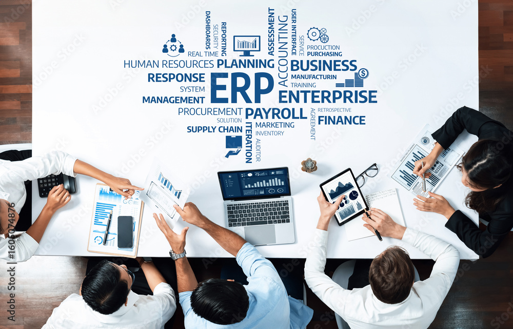 Poster a high-angle view of a team engaged in a business strategy meeting focused on erp, with charts and d