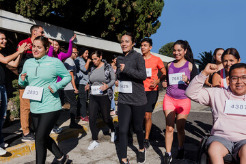 Latin people running marathon race in the streets in Mexico Latin America, group of hispanics runners 