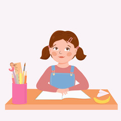 Cute little girl sitting on the desk
